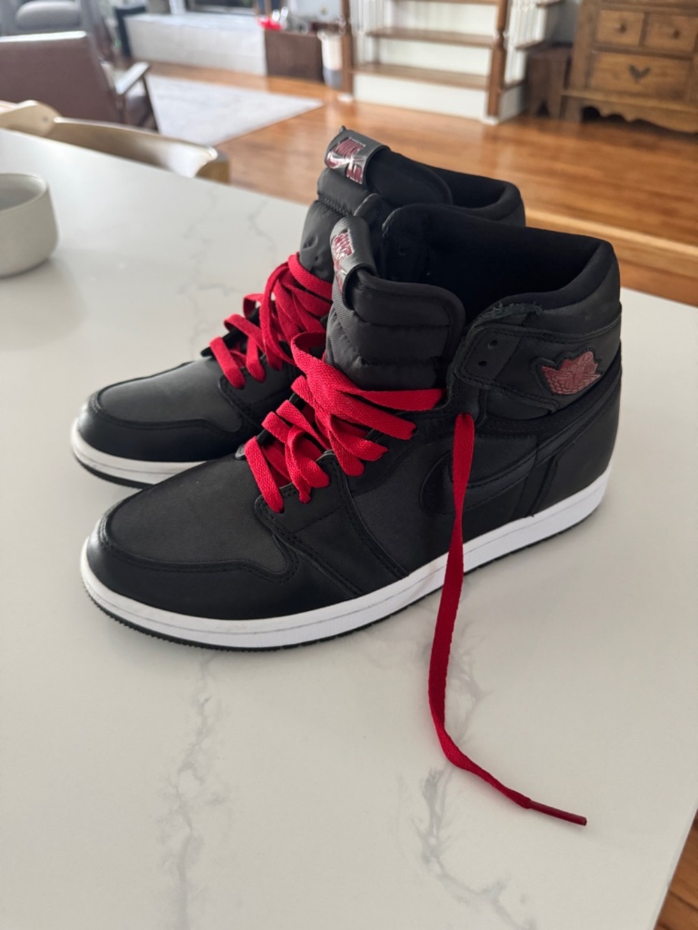 Nike Black High-Top Air Jordans with Red Laces
